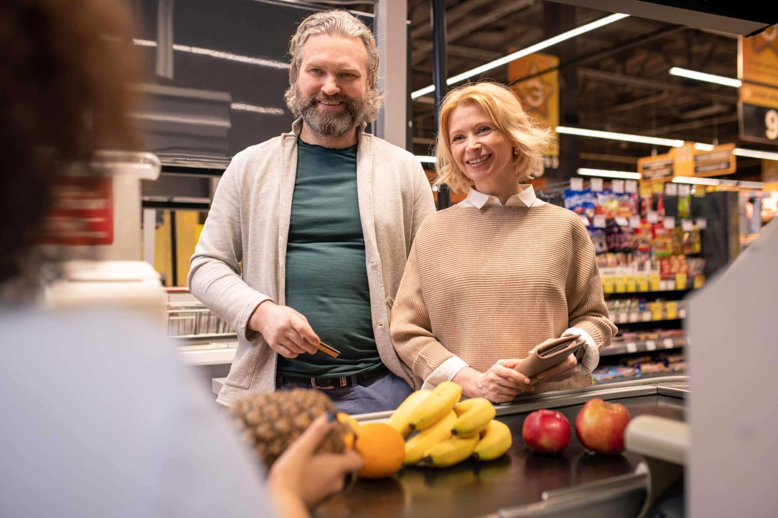 a happy couple at a small grocery store